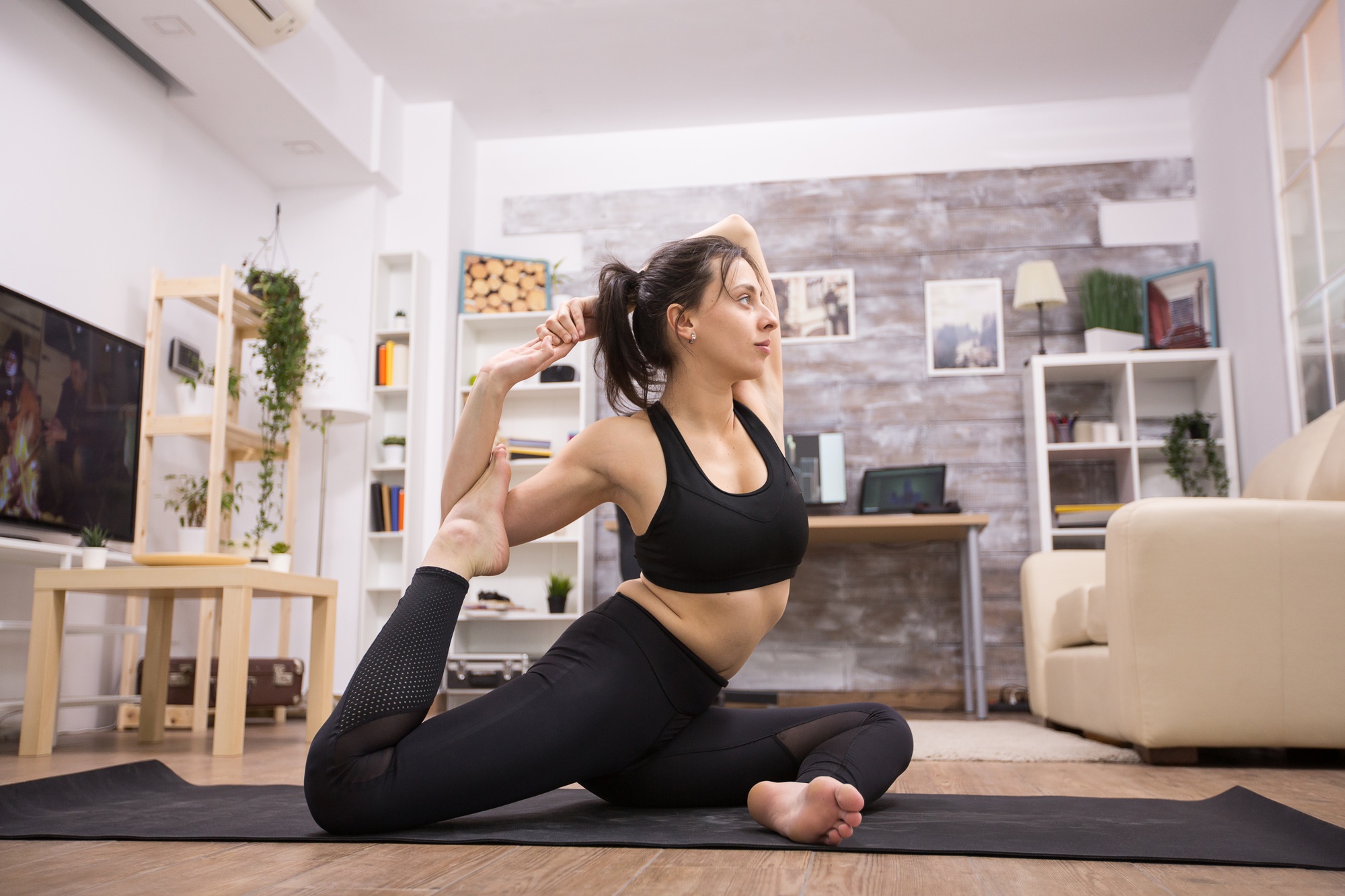 Caucasian beautiful practicing eka pada rajakapotasana